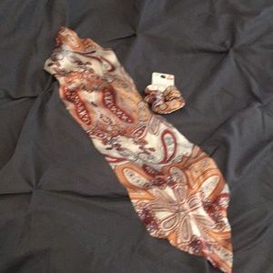 A scrunchie with a detachable scarf possibly satin